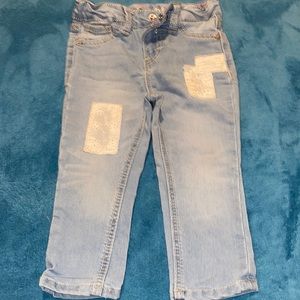 LEE Jeans, adorned w/white patches.